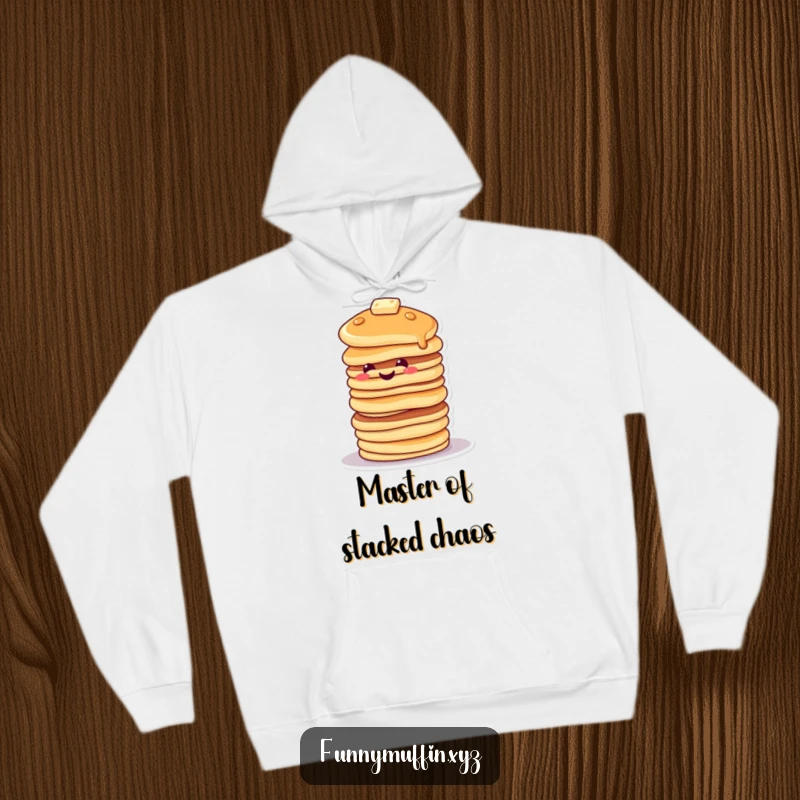 Funny hoodie depicting a smiling pancake character stacked high, tipping precariously, offering warmth and humor.